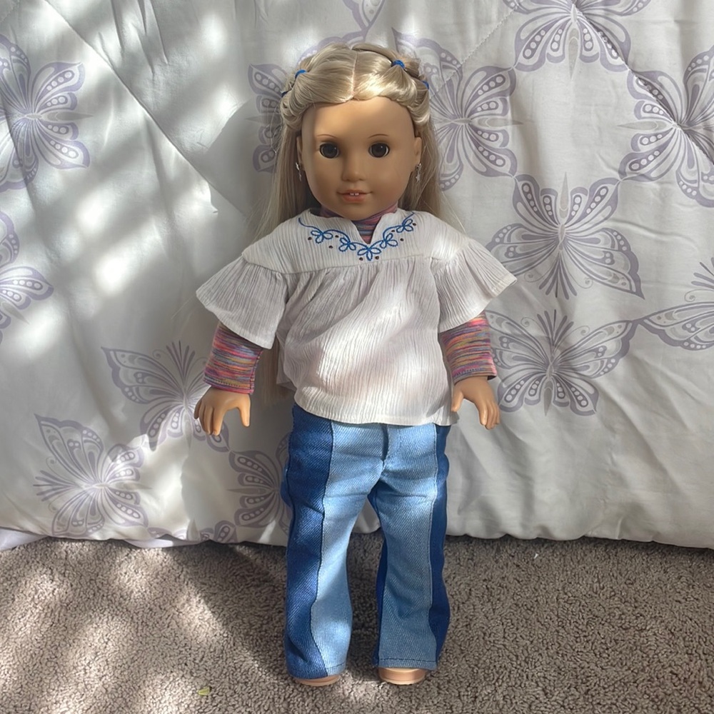 “Julie” American girl doll. Including an outfit and earrings.